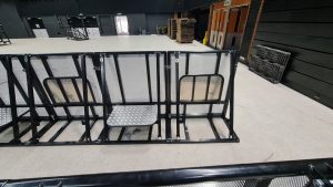 A robust pit barrier designed to enhance safety in performance areas. Constructed from durable materials, it effectively separates the audience from the pit, ensuring protection for performers and spectators alike.