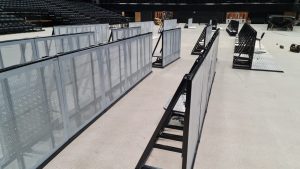 This pit barrier features a high-strength steel frame with aluminium front,step and base with a powder-coated finish for weather resistance. Its modular design allows for flexible installation and easy assembly, making it ideal for various event settings